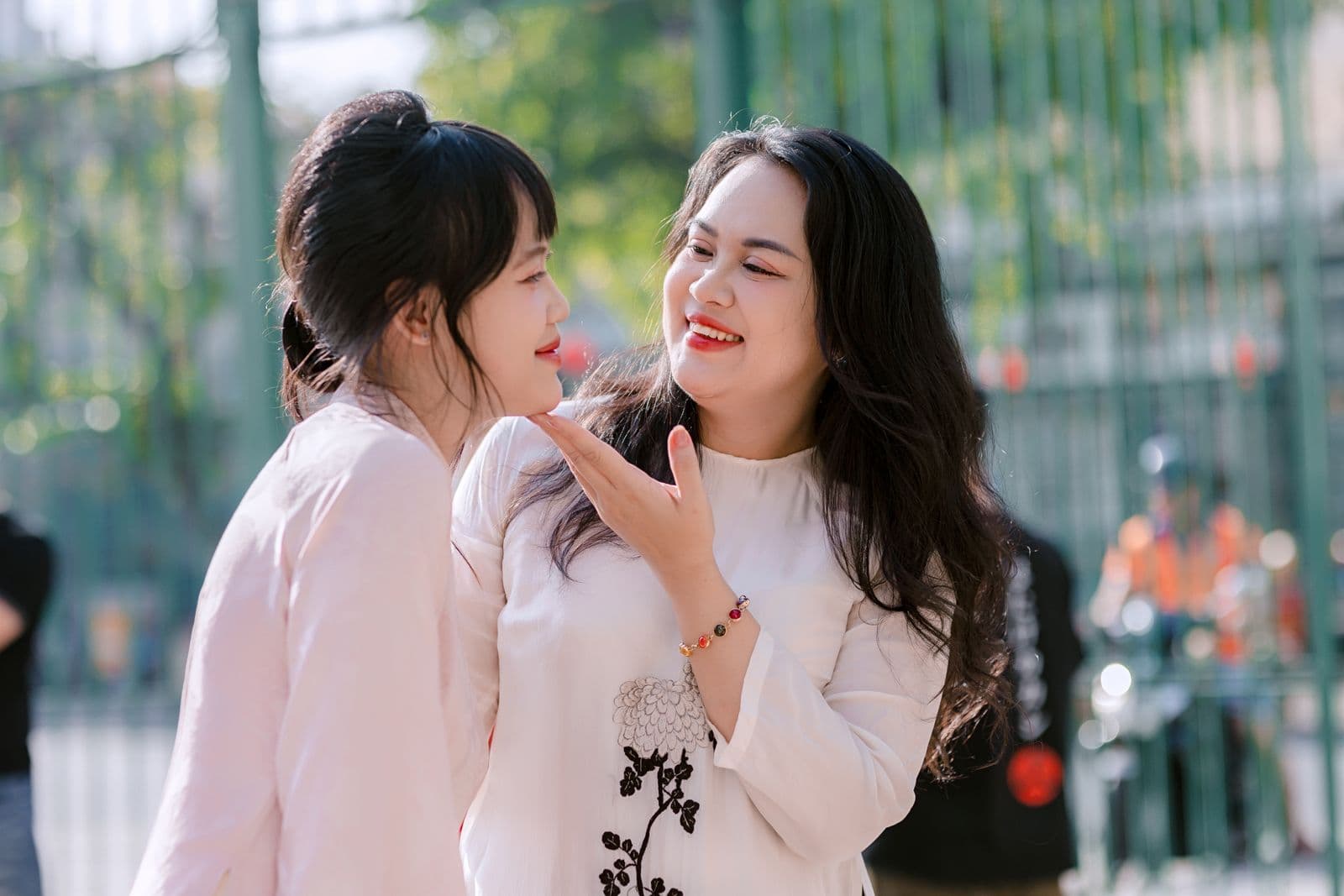 Two friends laughing together outdoors